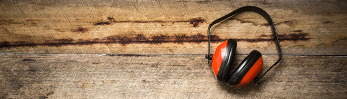 A pair of headphones on a wooden surface
